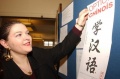 120px-A staff worker posts an announcement during a Chinese language teaching seminar held in Paris, France, on March 26, 2004..JPEG