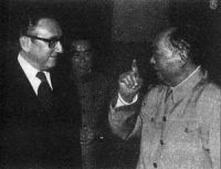 U.S. Secretary of State Henry Kissinger talks with Mao Zedong.